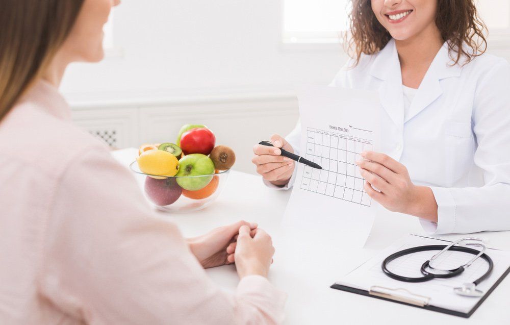 Healthy Nutrition Expert Making Weekly Meal Plan For Patient — Deception Bay Doctors In Deception Bay, QLD