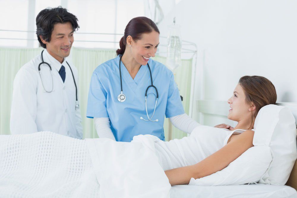Nurse And Doctor Checking Her Patient After Surgery — Deception Bay Doctors In Deception Bay, QLD