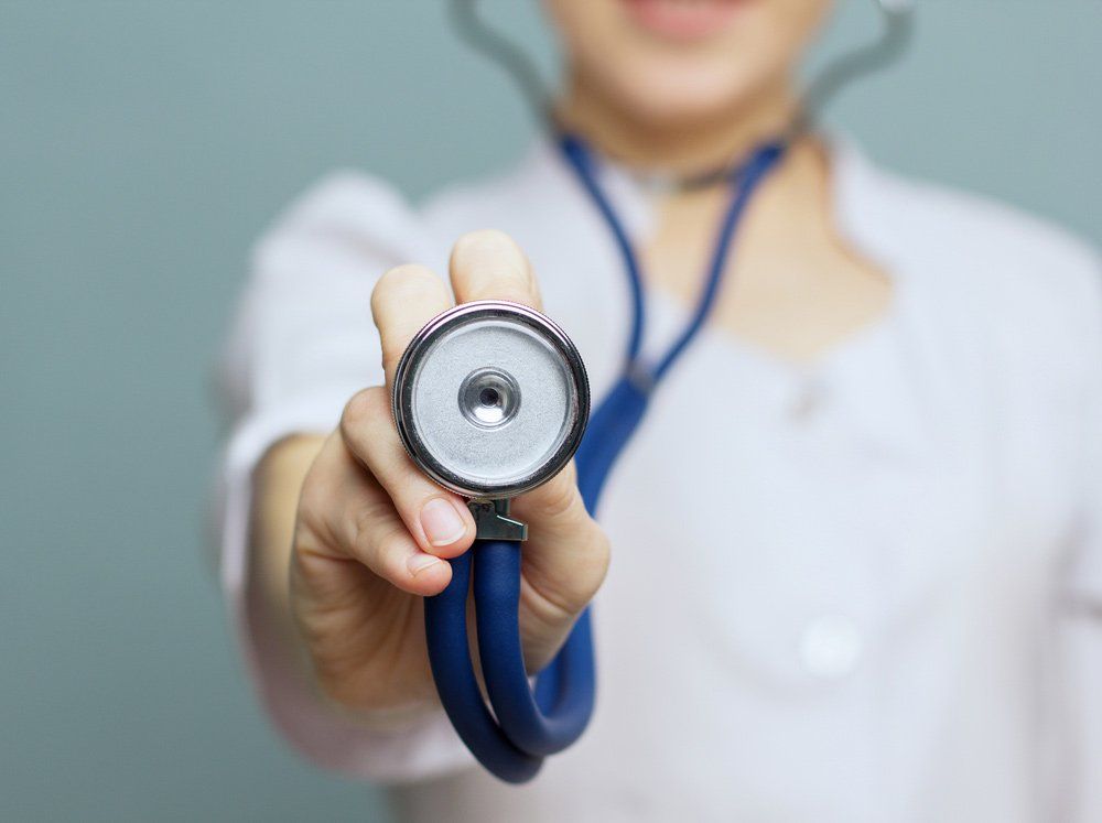 Female Doctor Holding A Stethoscope — Deception Bay Doctors In Deception Bay, QLD