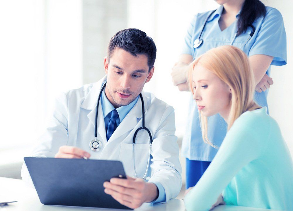 Male Doctor And Nurse With Patient— Deception Bay Doctors In Deception Bay, QLD