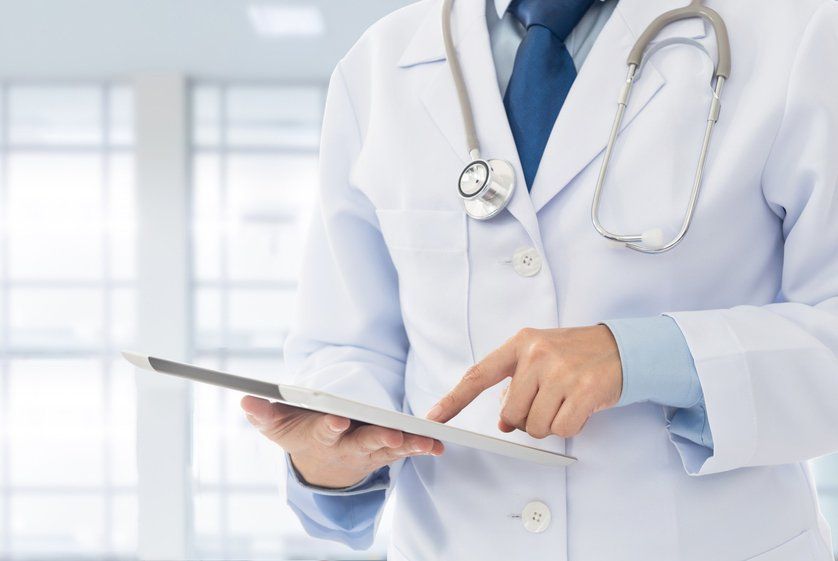 Doctor Using Digital Tablet — Deception Bay Doctors In Deception Bay, QLD