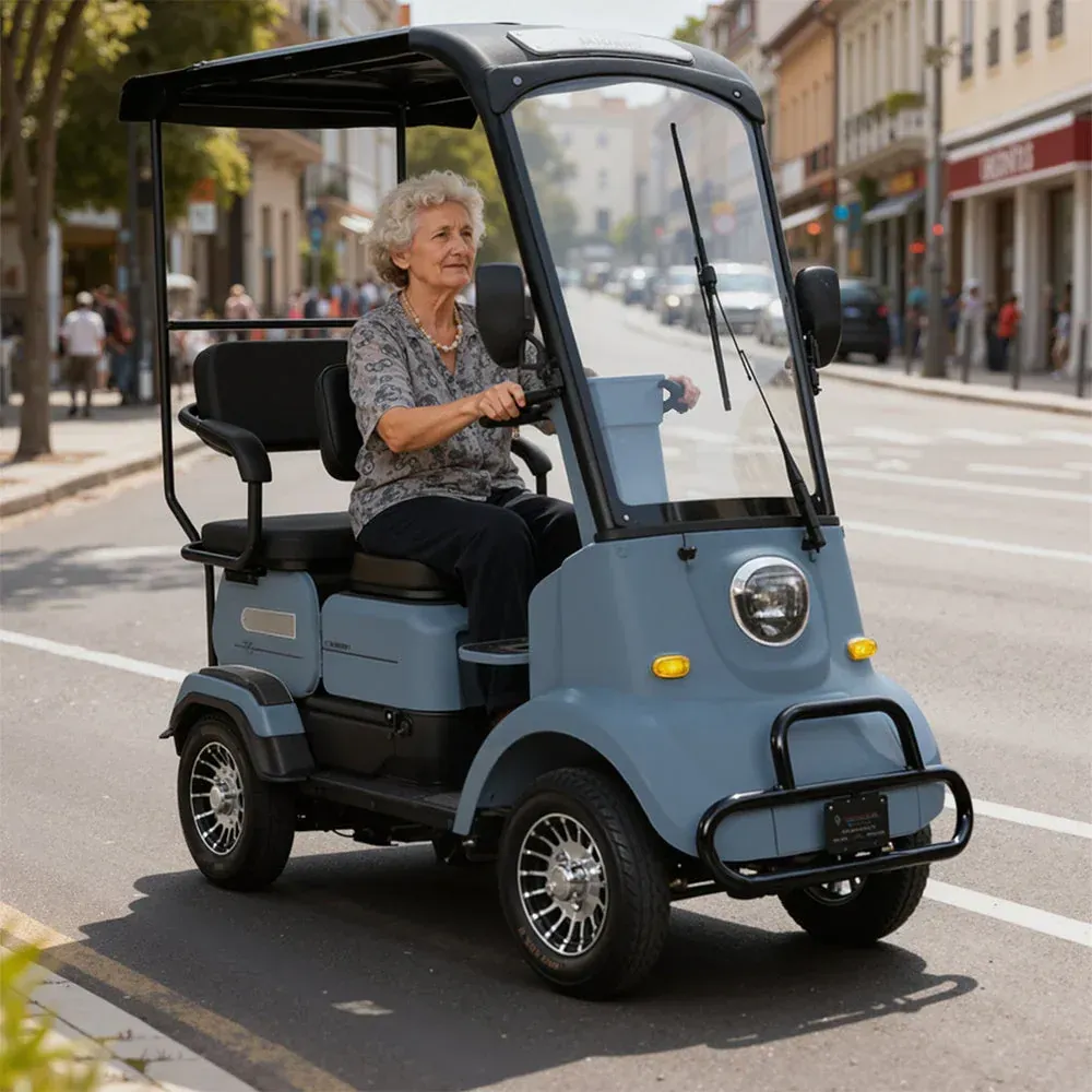 A dark gray electric scooter is parked and connected to a charging station on a sidewalk in front of a cafe.