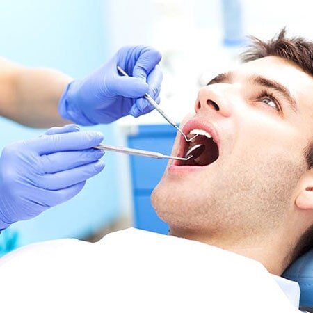 Man having teeth examined  - Dental Service in Green River, WY