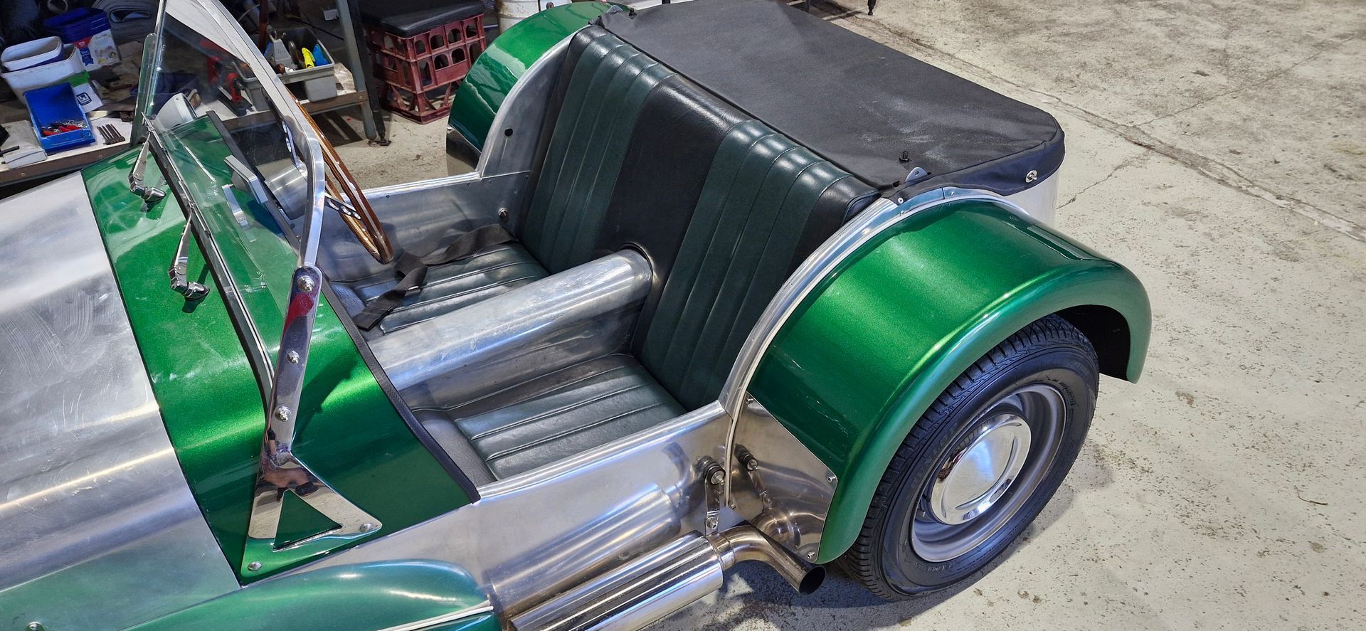 A partially assembled, green and aluminum-bodied vintage open-top roadster sports car — Tidy Trim Newcastle in Carrington, NSW