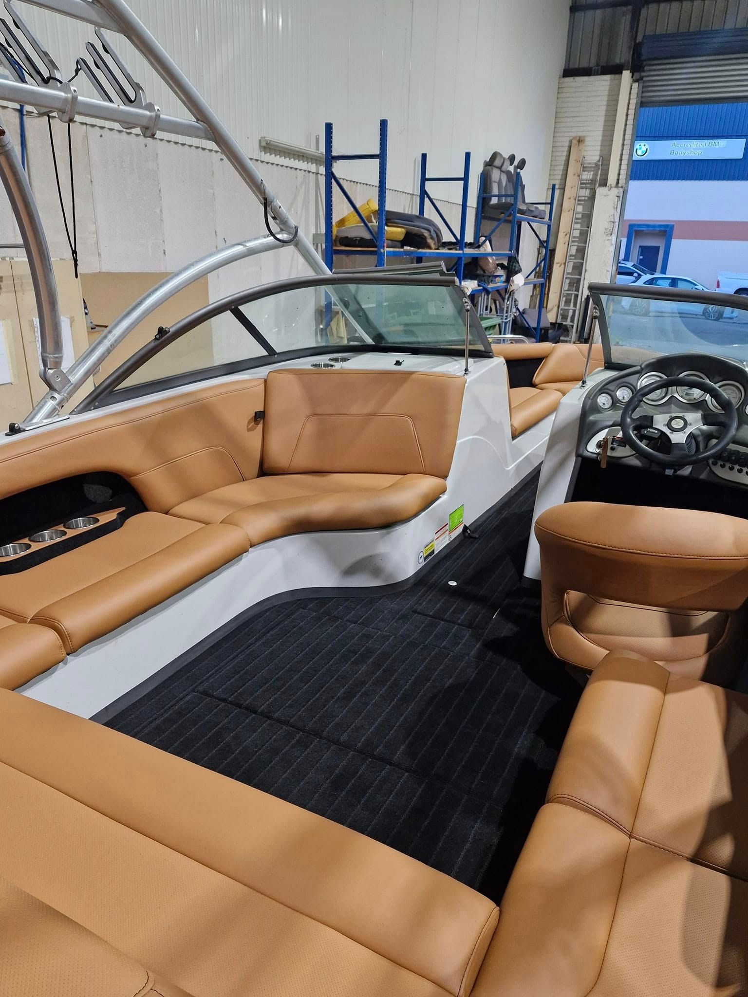 Boat interior with brown leather seating, black flooring — Tidy Trim Newcastle in Carrington, NSW