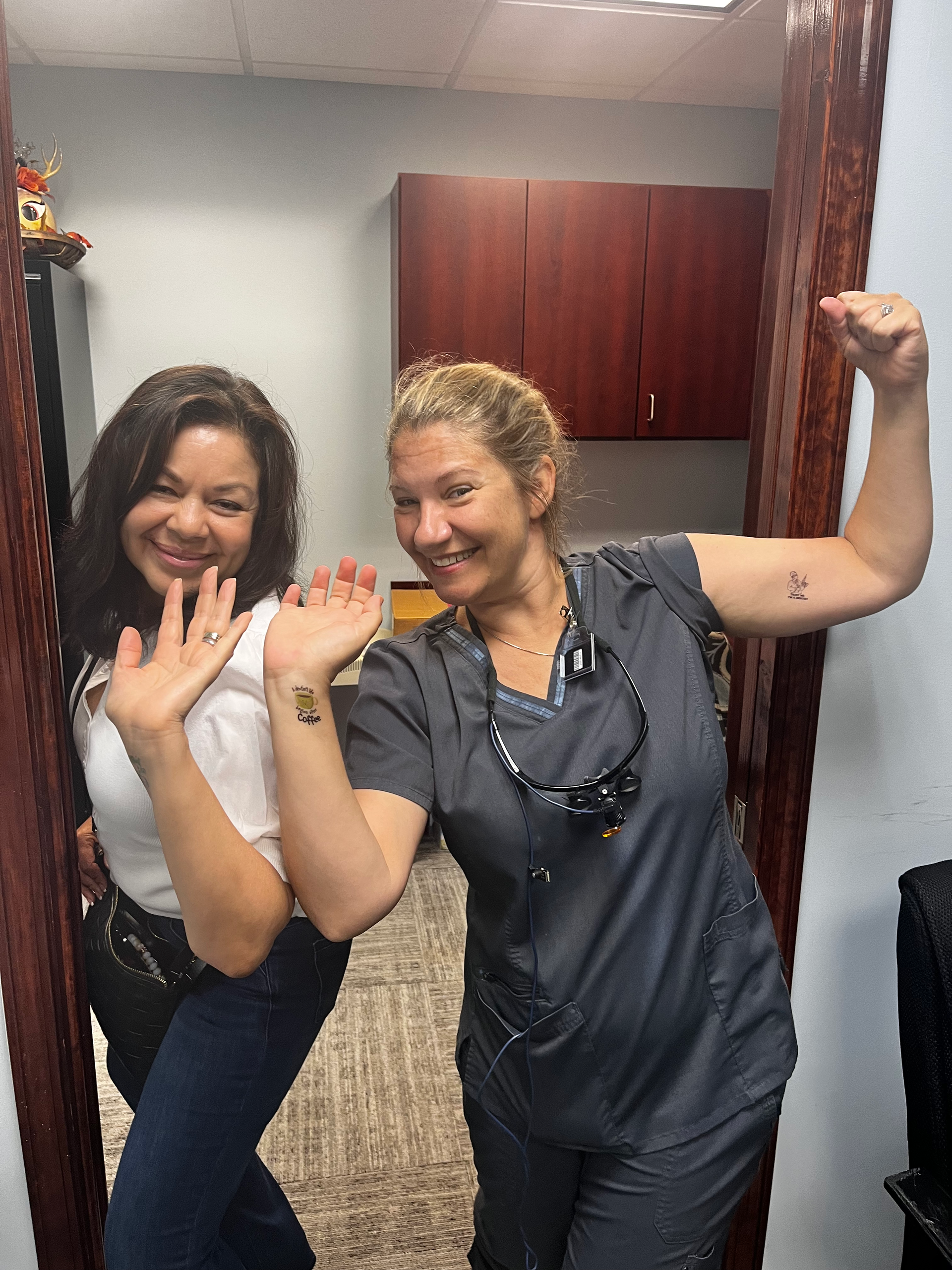 A white building with a sign that says family dentistry