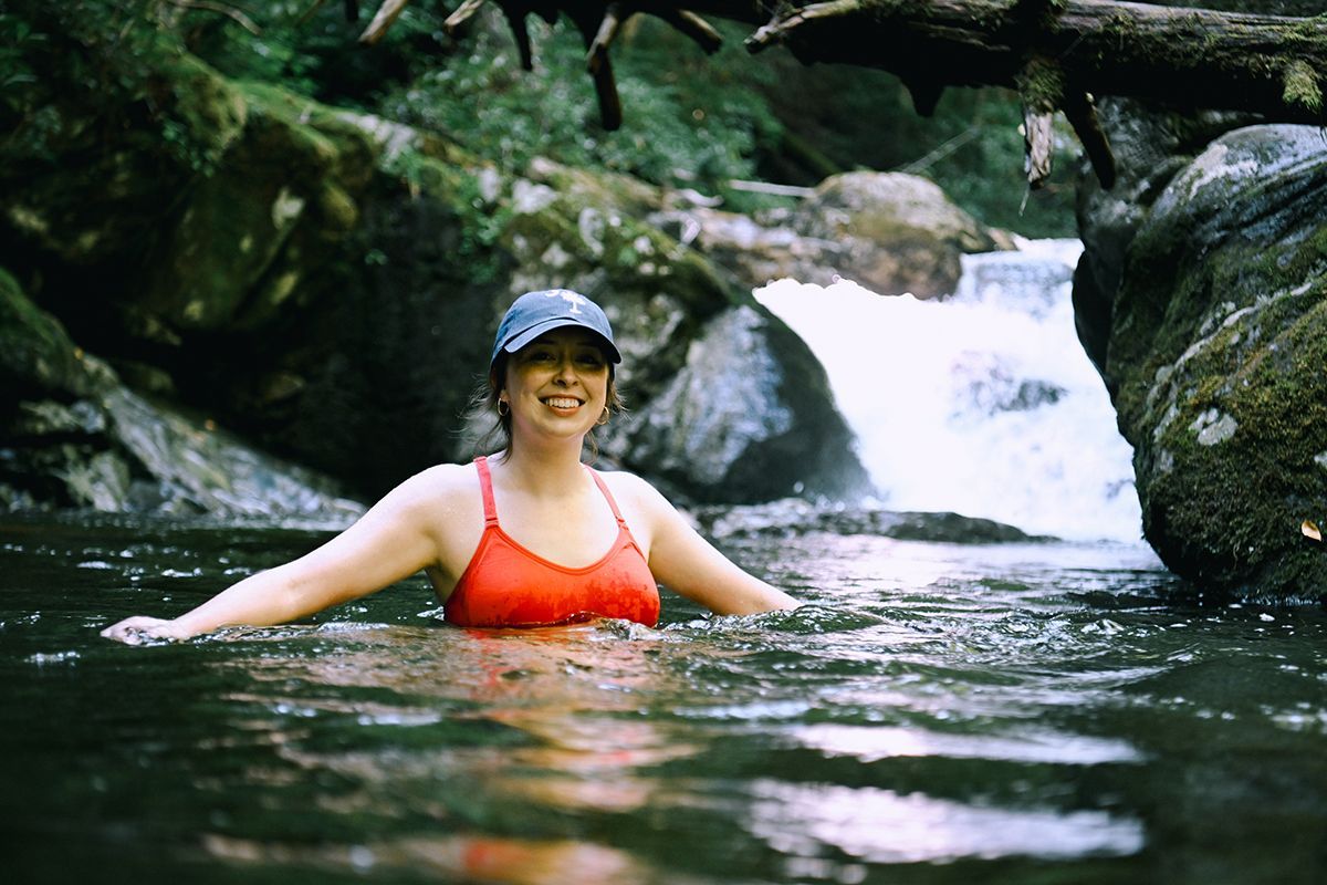 A person is soaking in a pool of natural cold water