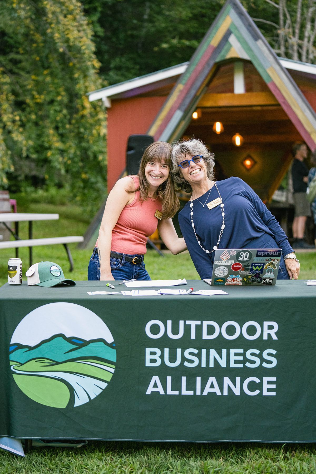 A group of people are roasting marshmallows over a fire pit.