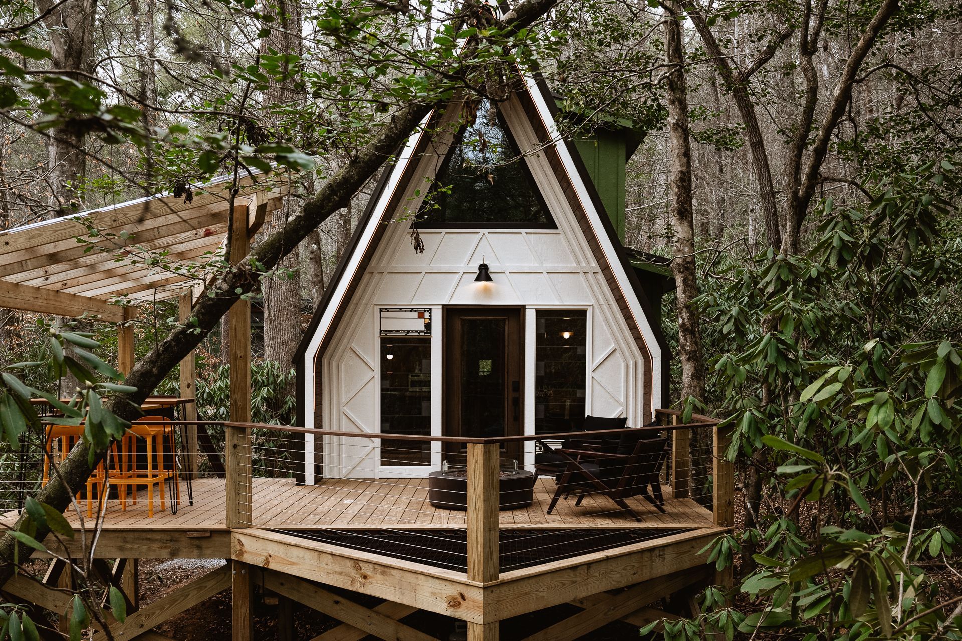 An a-frame cabin in the woods