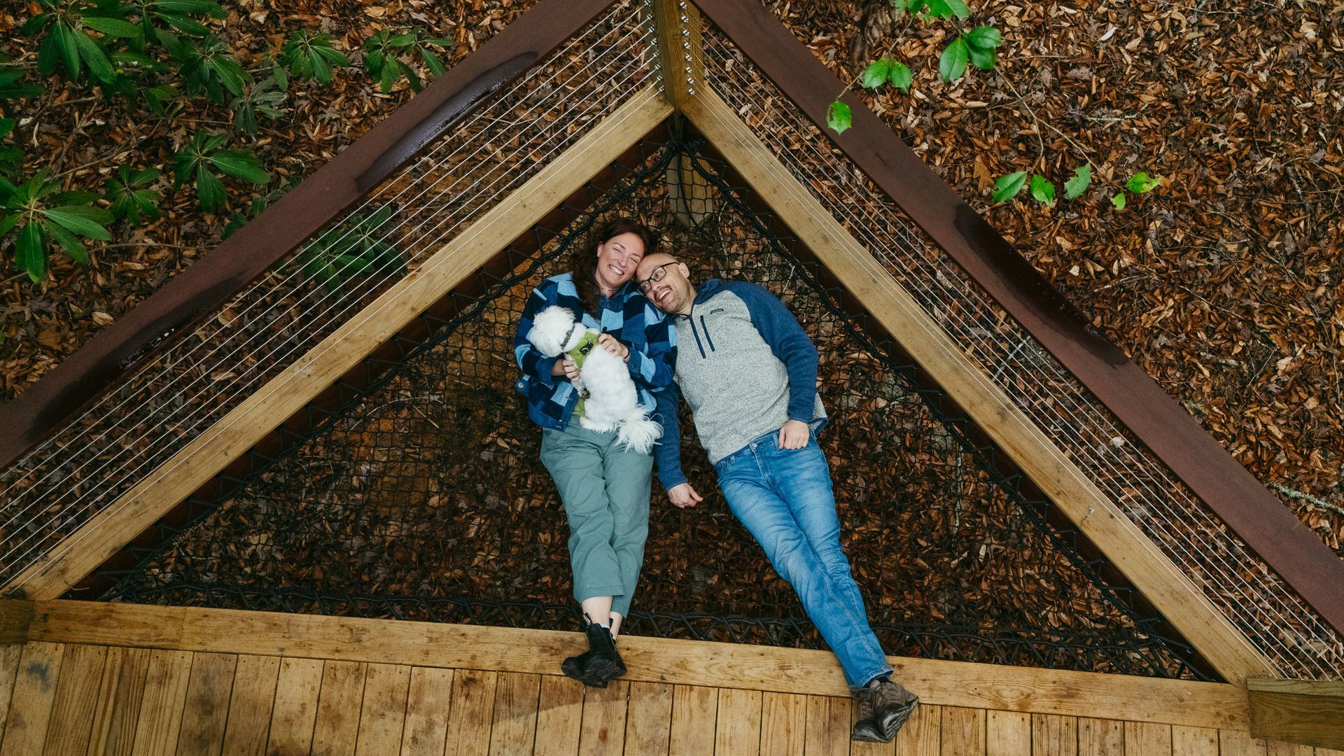 A couple relaxes on a hammock