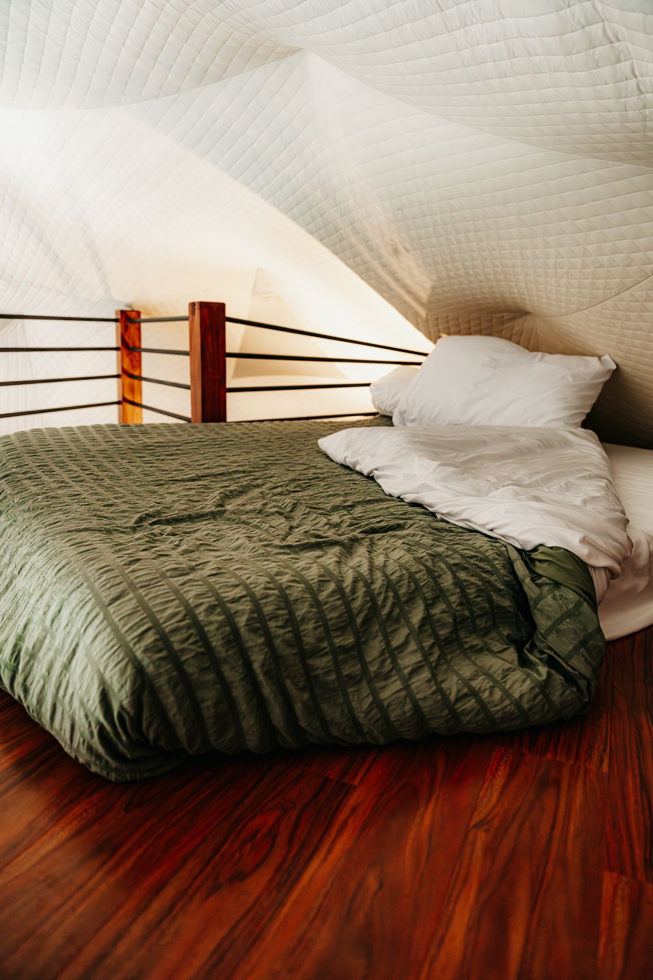 A loft bed in a camping dome