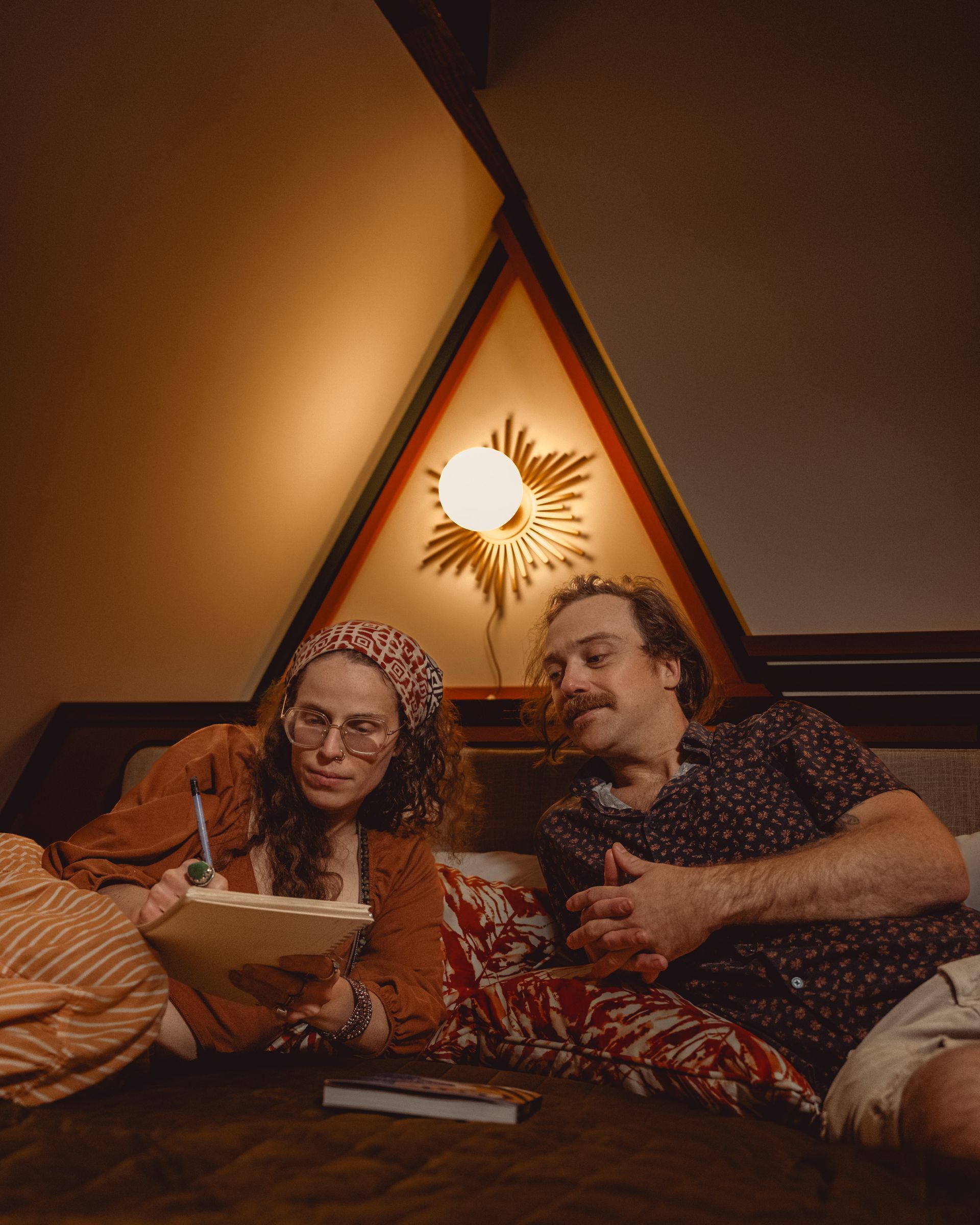 A couple relaxes in bed