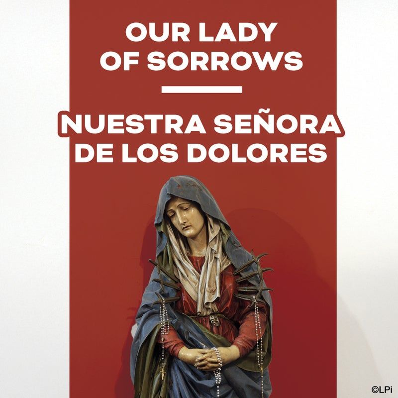 A statue of Our Lady of Sorrows wearing a blue veil and red robes, set against a red background with text in English/Spanish.