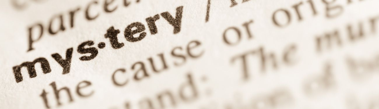 A close up of the word mystery in a dictionary.