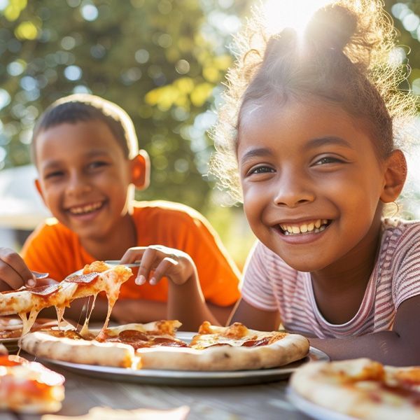 Image for blog post January 17, 2025: three kids eating pizza at a birthday party. 