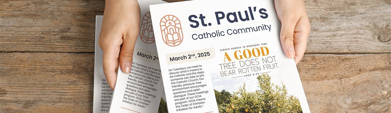 Hands hold a printed Catholic bulletin.