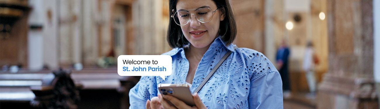 Woman inside a church looking at her phone. The screen reads 