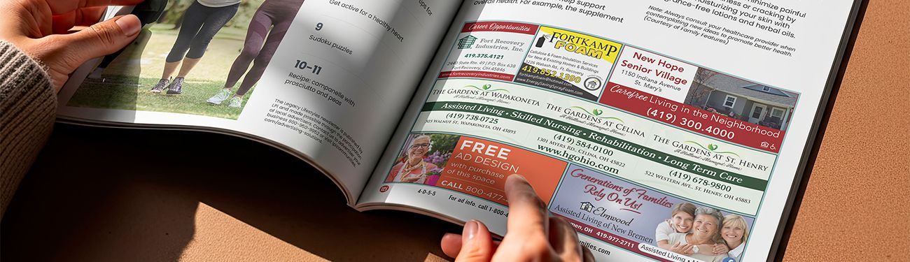 Close-up view of a newsletter open to an ads section.