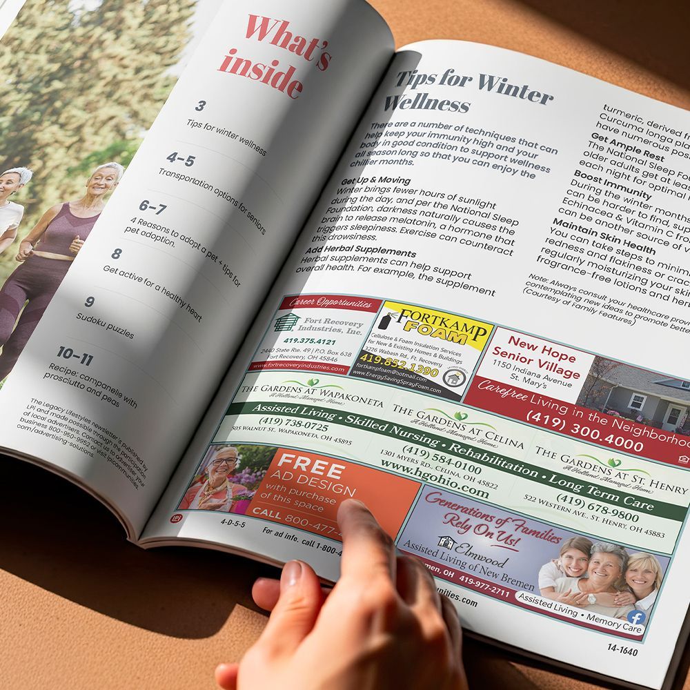 Close-up view of a newsletter open to an ads section.