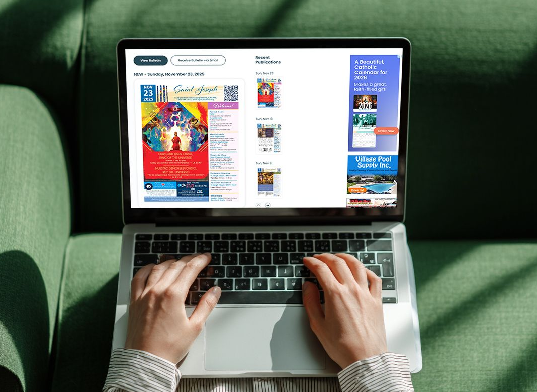 A person is typing on a laptop computer that is on a the Parishes Online website.