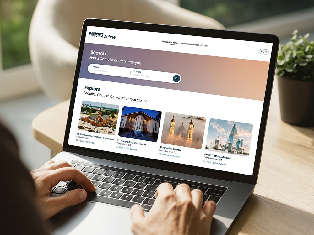 Hands typing on a laptop showing a website with destination cards and search bar.