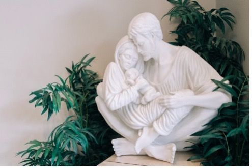 A statue of a Mary and Joseph holding baby Jesus.