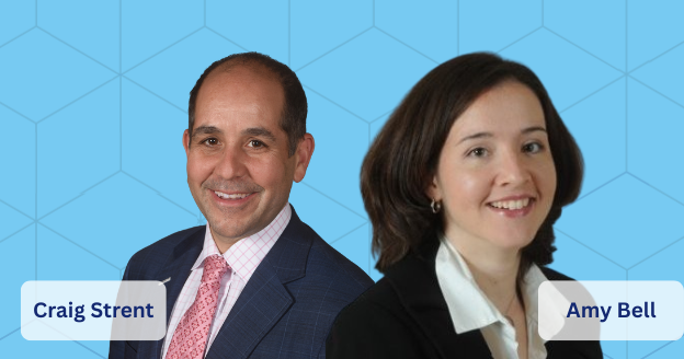 A large group of people are posing for a picture under a tree.