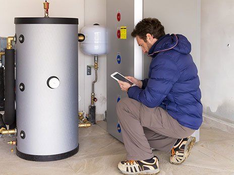 Water Heater – Man Inspecting the Water Heater in Westchester, IL
