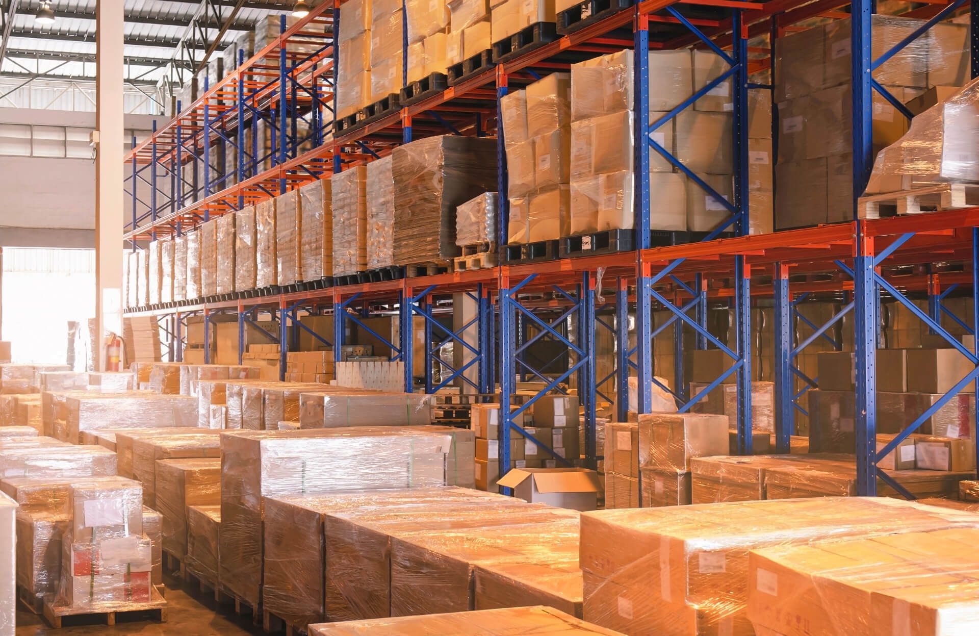 A large warehouse filled with lots of boxes and shelves