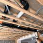 A ceiling with a lot of pipes coming out of it