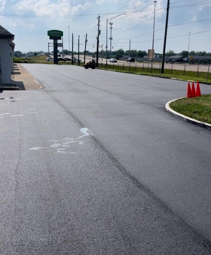 A motorcycle is parked on the side of the road