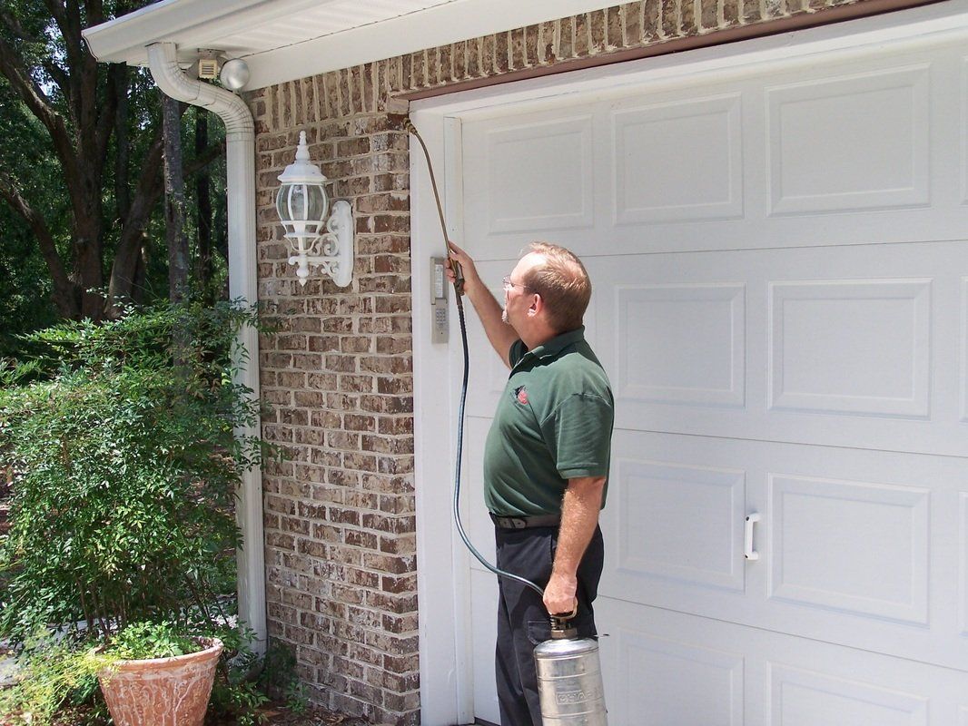 Man Exterminating A House — Tallahassee, FL — Rock Solid Termite and Pest Control