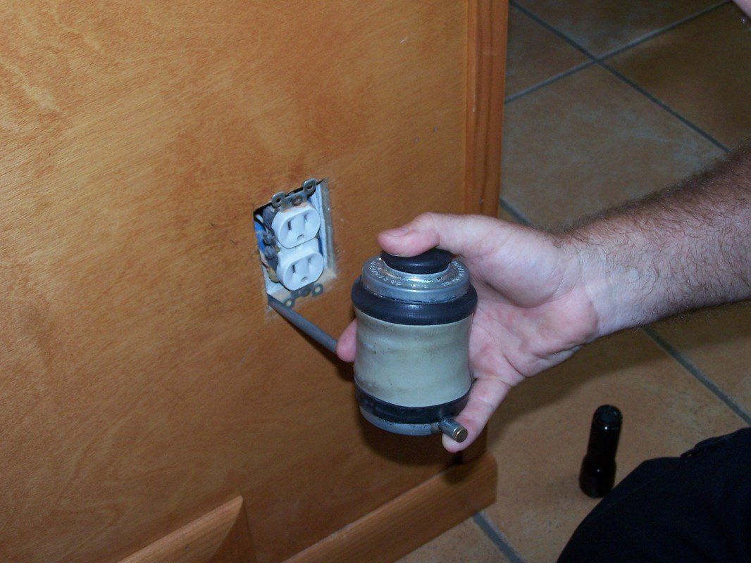 Man Exterminating A Switch — Tallahassee, FL — Rock Solid Termite and Pest Control