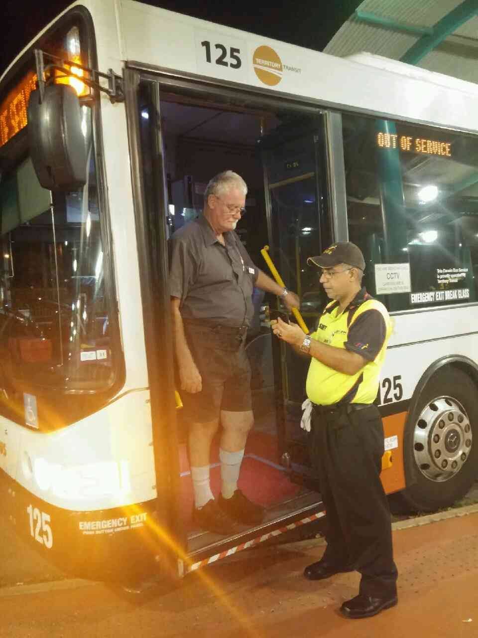 A Man Getting Off A Bus With The Number 125 On It - Security in the Top End, NT