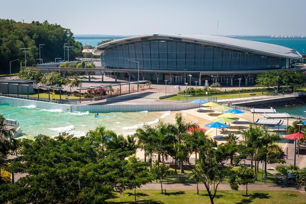 An Aerial View Of A Beach With A Large Building In The Background - Comprehensive Security Services in Top End, NT