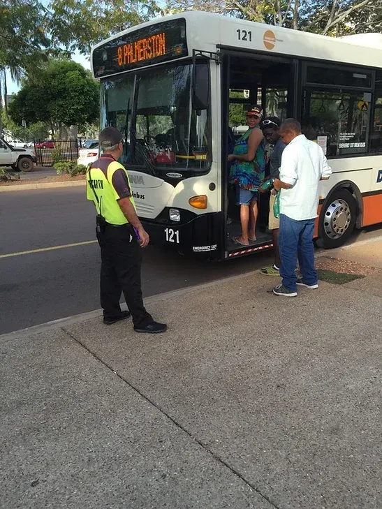 A Security Guard Standing Outside Of A Bus - Providing Mobile Security in Darwin, NT