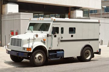 A White Armoured Van Parked - Comprehensive Security Services in Darwin, NT
