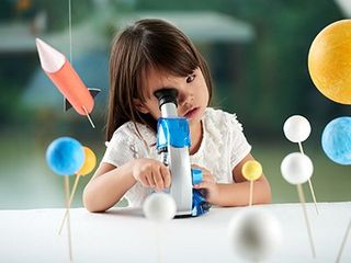 Childhood Development — Girl Looking at Microscope Concept in Sunrise, Fl