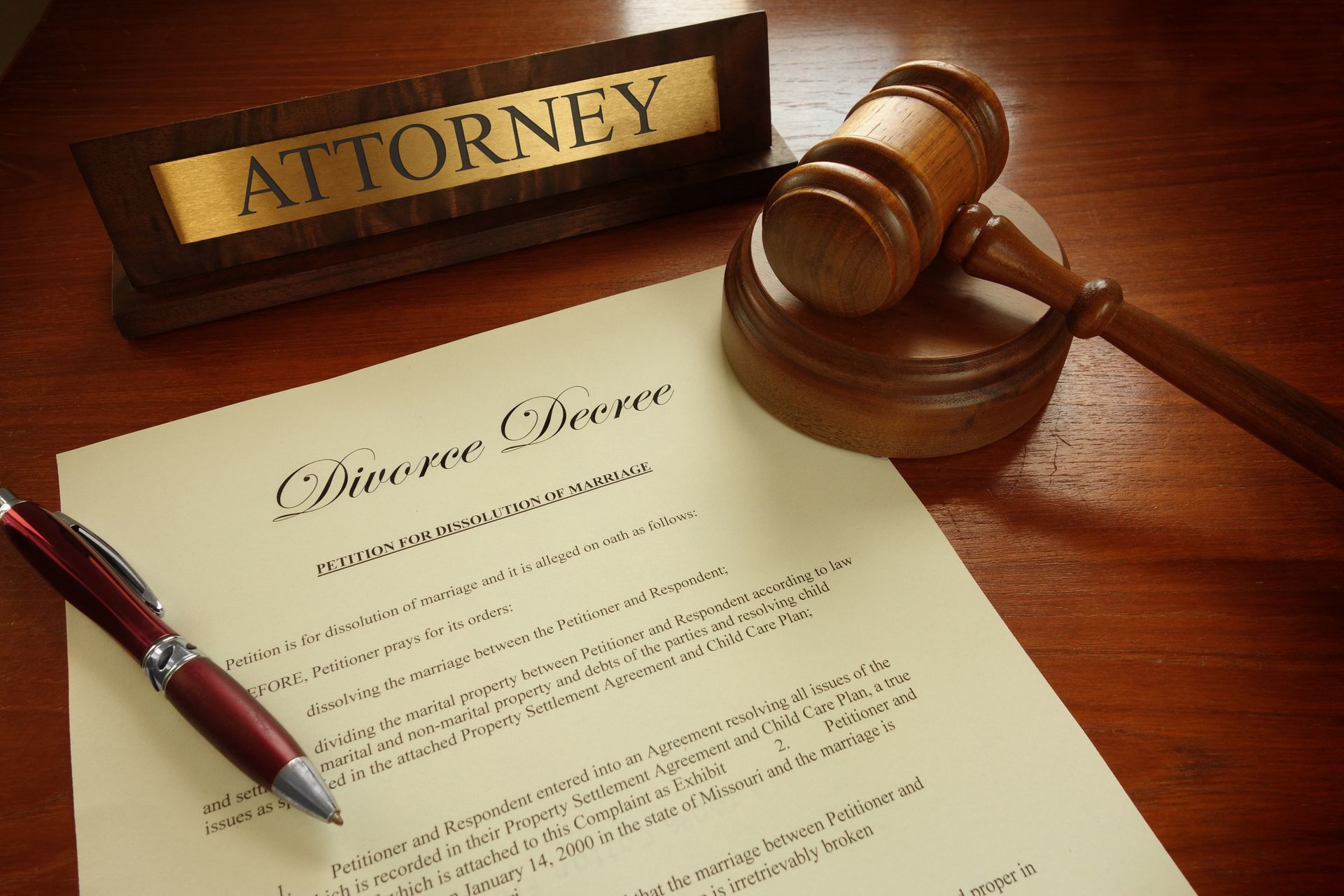 A divorce decree resting on an experienced divorce lawyer's desk awaiting review in Sunshine. A divorce decree resting on an experienced divorce lawyer's desk awaiting review in Sunshine.