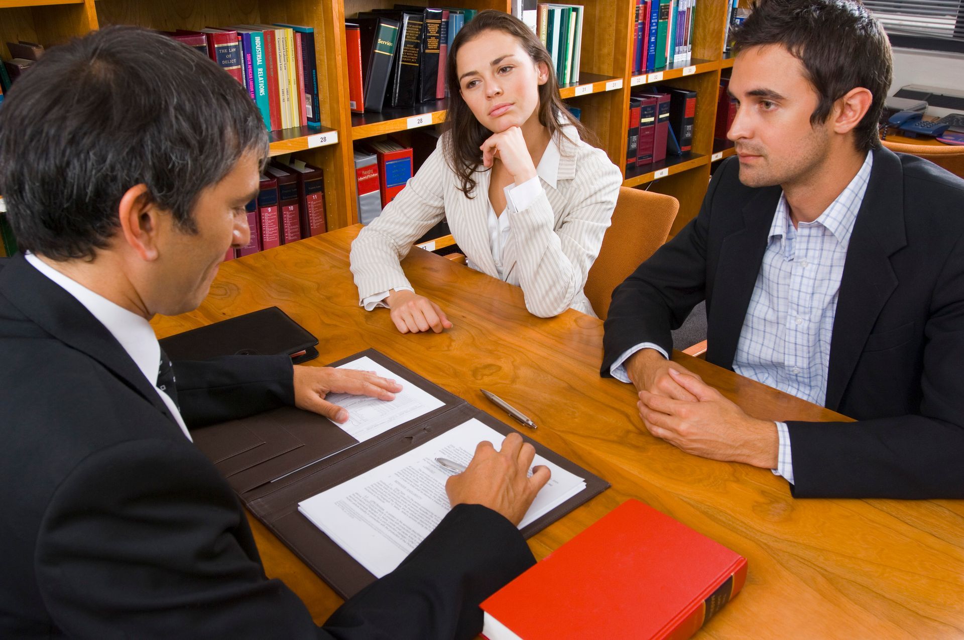 A couple discussing their marriage dissolution with an experienced divorce lawyer in Sunshine. A couple discussing their marriage dissolution with an experienced divorce lawyer in Sunshine.