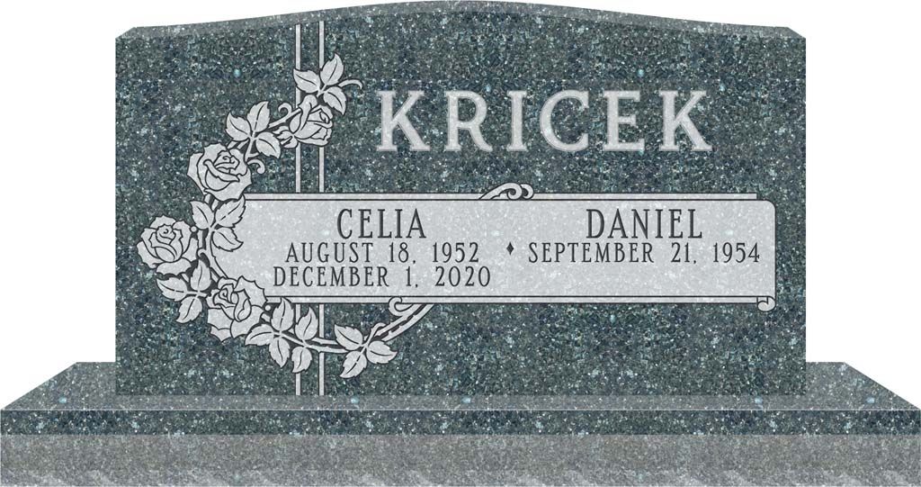 Granite gravestone with “KRICEK” and floral engraving, showing names and dates on a small plaque.