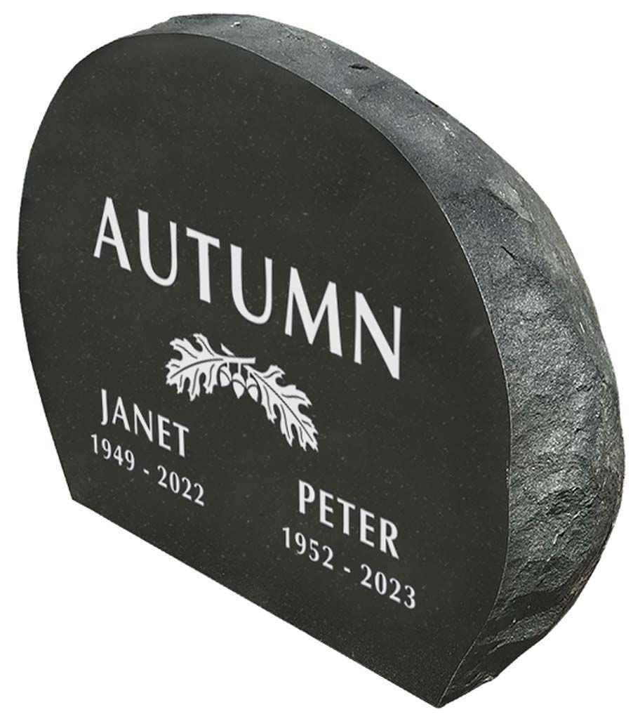 Black granite memorial stone with engraved white names Autumn, Janet, and Peter.