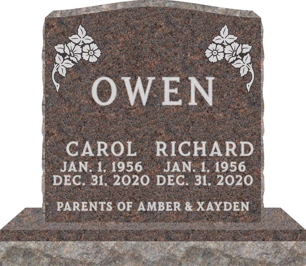 Gray granite memorial headstone engraved with Owen, Carol, and Richard, with floral carvings.