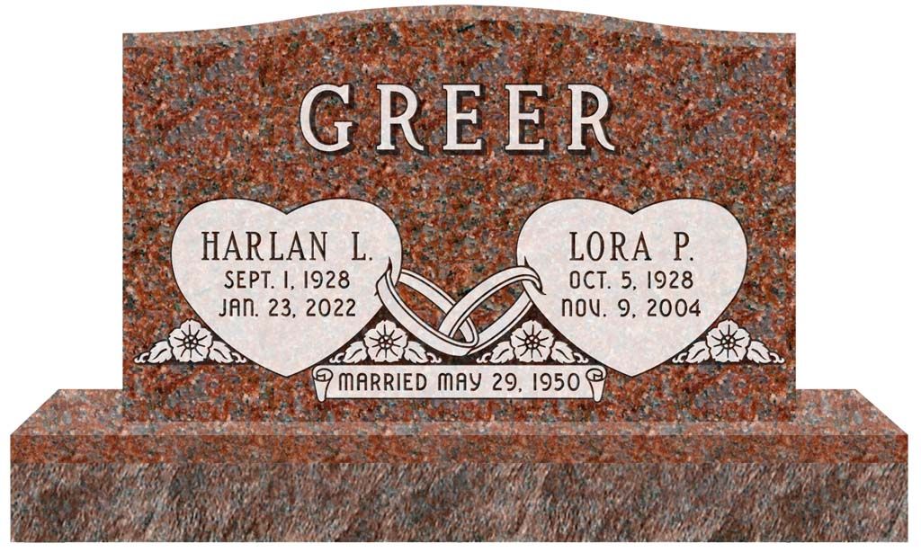 Granite memorial with two heart plaques and engraved name GREER, with marriage date plaque