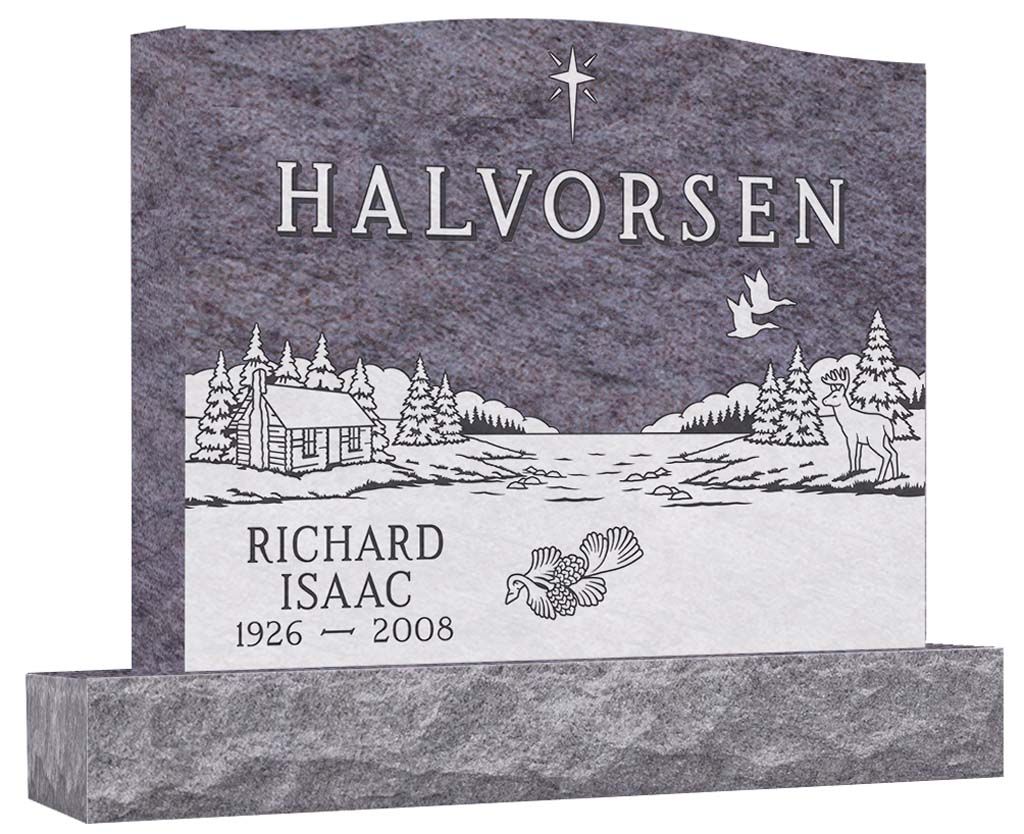 Gray granite gravestone with engraved name Halvorsen, white snowy landscape and small village scene