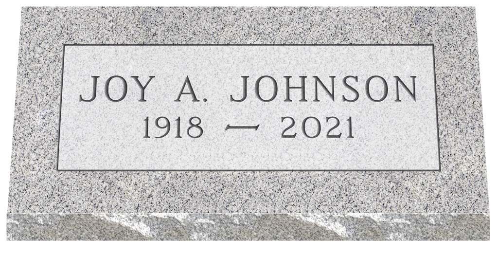 Gravestone plaque for JOY A. JOHNSON, 1918–2021, on a gray stone surface.