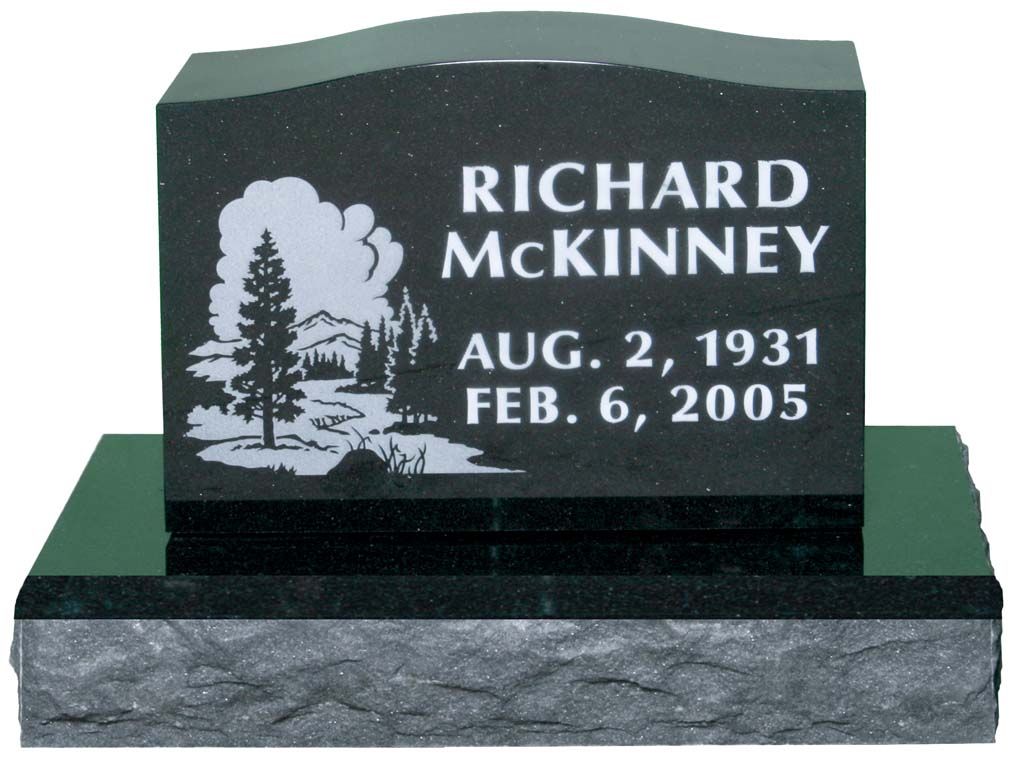 Black granite grave marker engraved “Richard McKinney,” with dates Aug. 2, 1931 and Feb. 6, 2005.