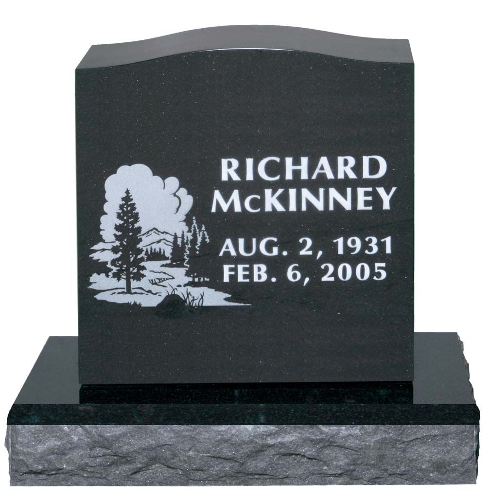 Black granite memorial headstone for Richard McKinney, with tree engraving and dates Aug. 2, 1931–Feb. 6, 2005