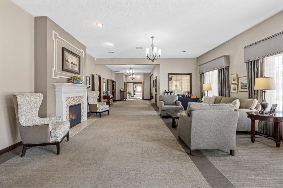A living room filled with furniture and a fireplace.