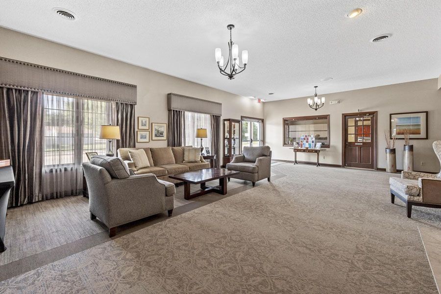 A living room filled with furniture and a chandelier.
